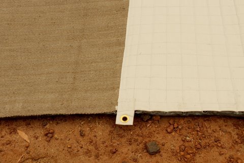 grommet holes at side where cocoa mat meets end by The Mat King